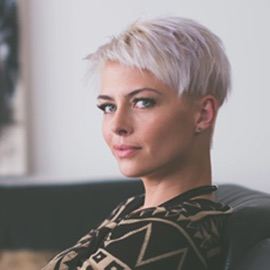 woman with a platinum blonde pixie haircut